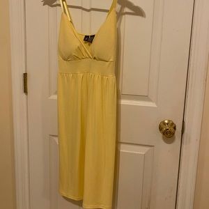 Yellow summer dress ties in the back with adjustable straps